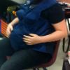 Maddie McMickle wearing the empathy belly during PACES presentation