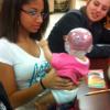 Shea Anderson with the Shaking Baby Syndrome model during the PACES Presentation